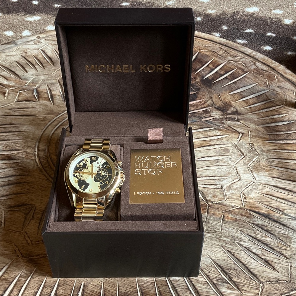 Women’s Michael Kors Gold and Black “Watch Hunger Stop” Chronograph Watch